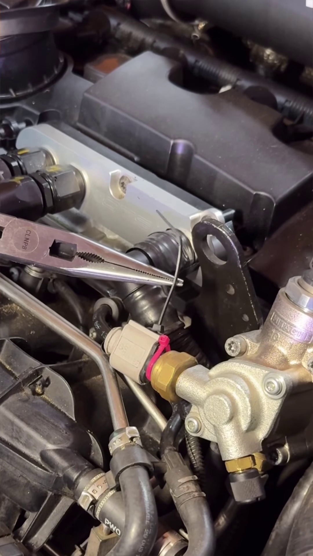 Close-up of Kaytea’s Volkswagen GTI engine bay during repairs