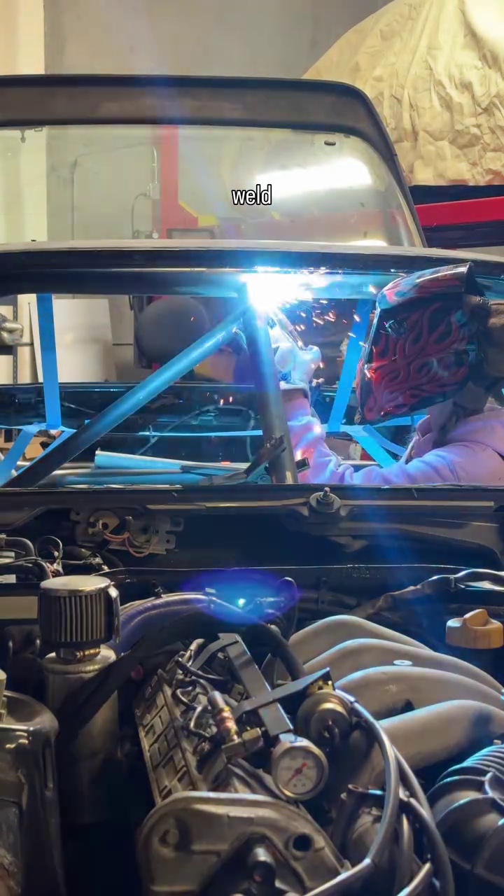 Welding the roll cage inside the Porsche 944